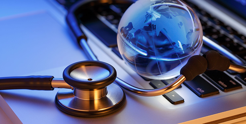 laptop, stethoscope, globe